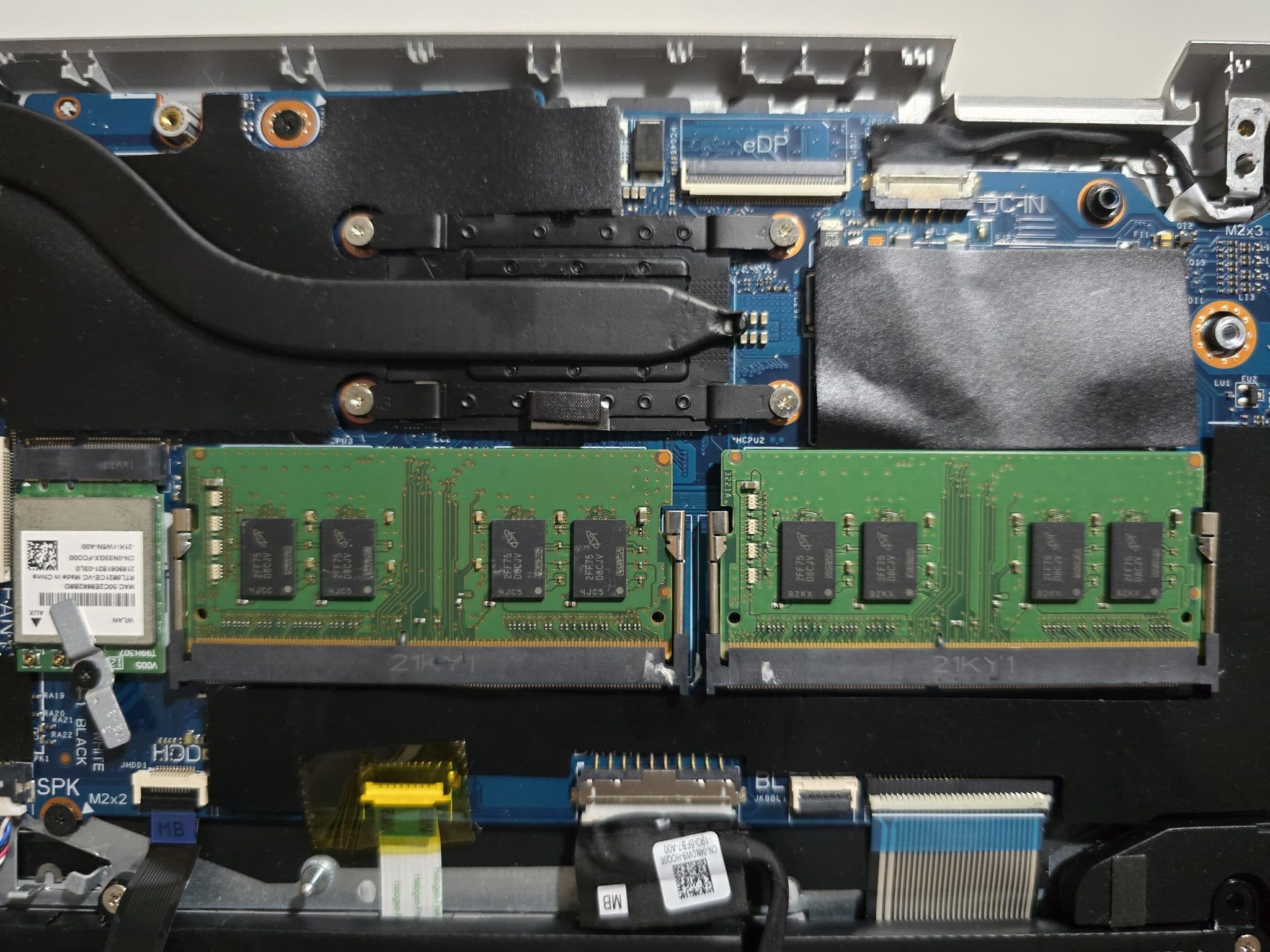 Two RAM modules on a laptop motherboard